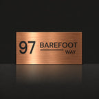 Brushed copper house number and street name sign with a brushed metal look, The Alexandra, reading 97 Barefoot Way in black lettering.