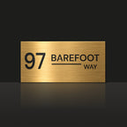 Brushed gold house number and street name sign with a brushed metal look, The Alexandra, reading 97 Barefoot Way in black lettering.