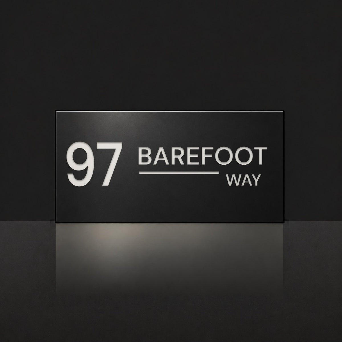 Matte black house number and street name sign, The Alexandra, reading 97 Barefoot Way in white lettering.