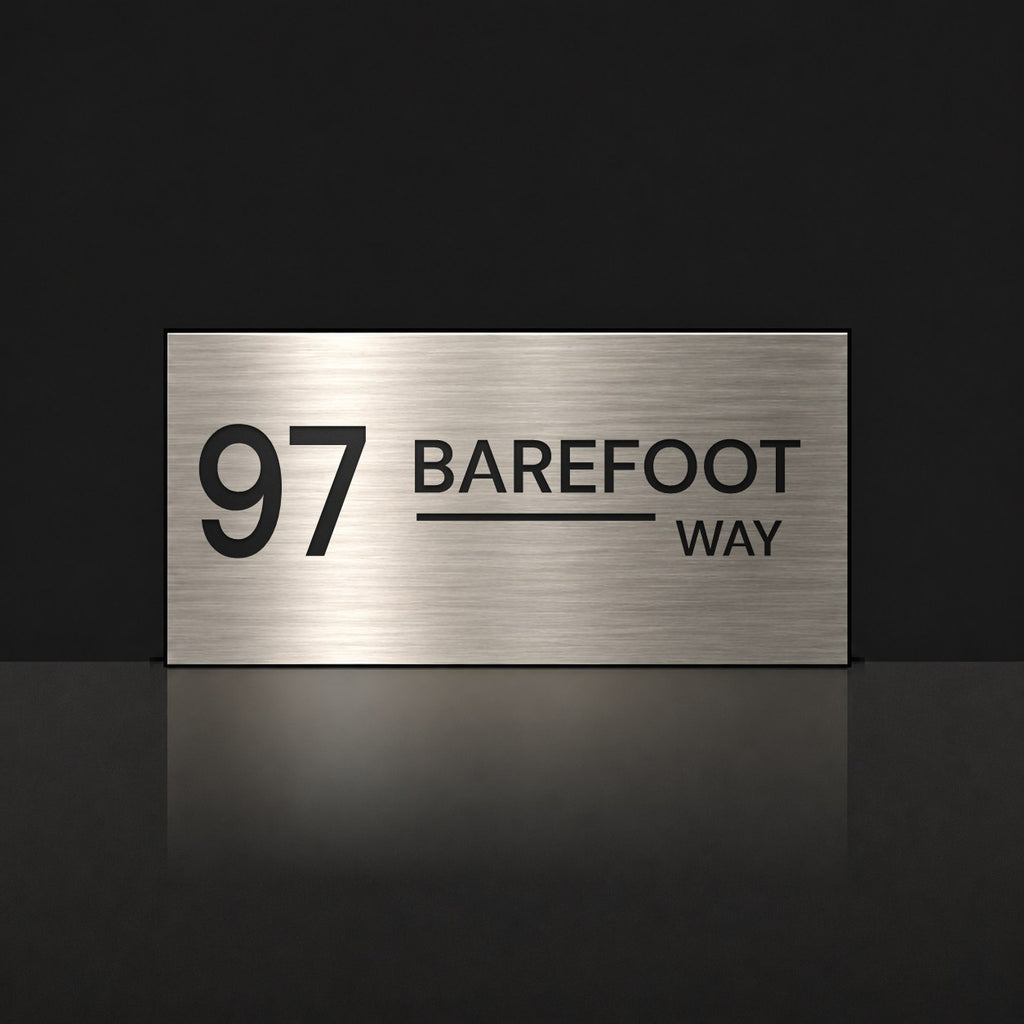 Brushed silver house number and street name sign with a brushed metal look, The Alexandra, reading 97 Barefoot Way in black lettering.