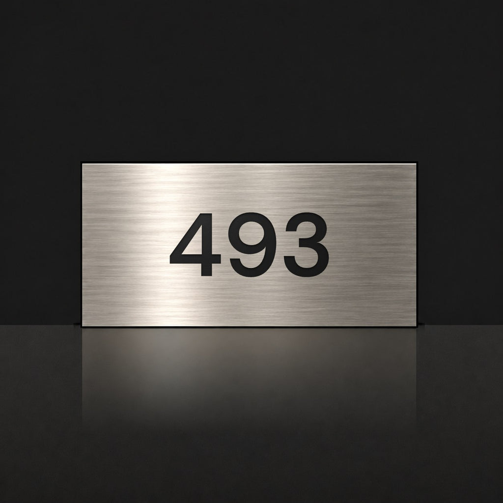 Brushed silver house number sign with a brushed metal look, The Kawana, with the number 493 in black lettering.