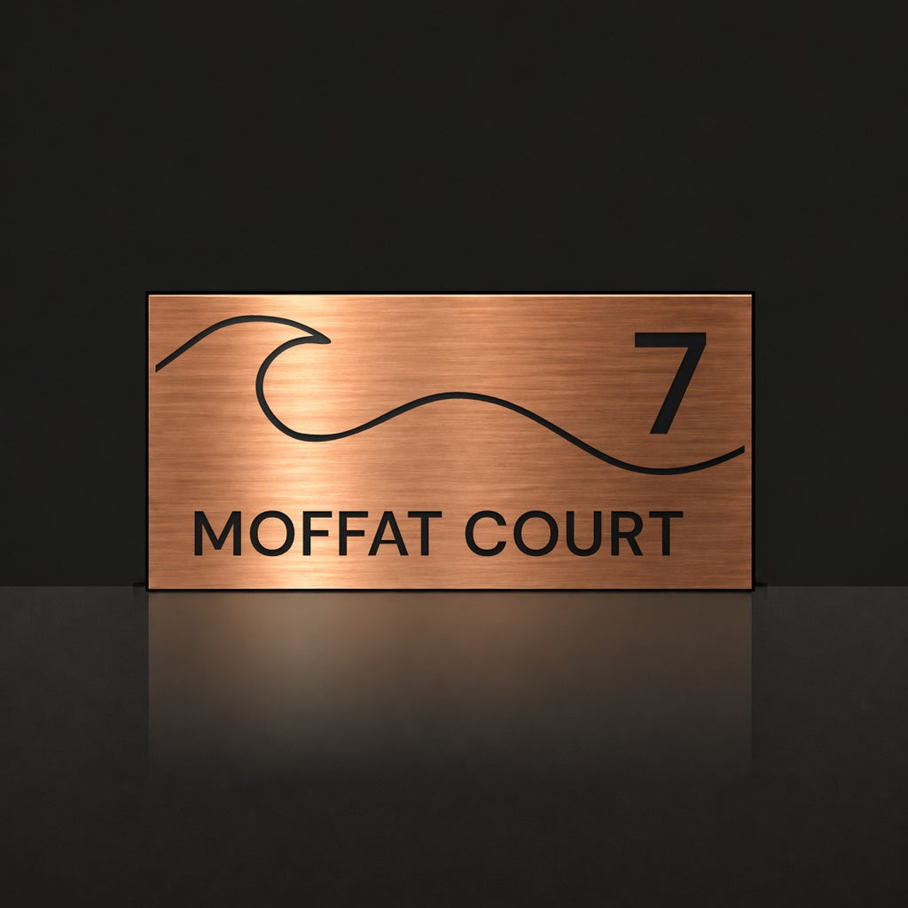 Brushed copper house number and street name sign with a brushed metal look, The Moffat, reading 7 Moffat Court in black lettering, with a wave.