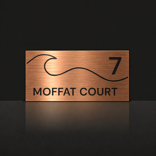 Brushed copper house number and street name sign with a brushed metal look, The Moffat, reading 7 Moffat Court in black lettering, with a wave.