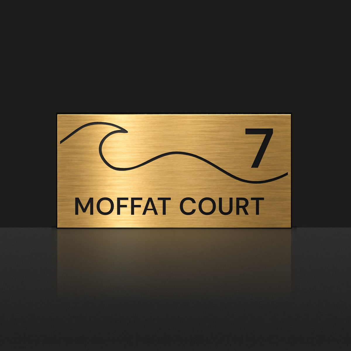 Brushed gold house number and street name sign with a brushed metal look, The Moffat, reading 7 Moffat Court in black lettering, with a wave.