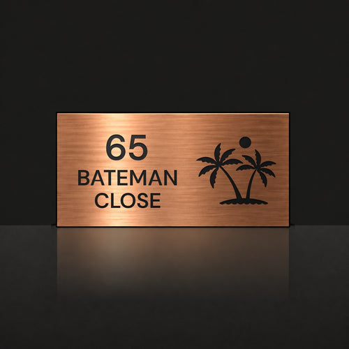 Brushed copper house number and street name sign with a brushed metal look, The Yaroomba, reading 65 Bateman Close in black lettering, with palm trees and a sun.