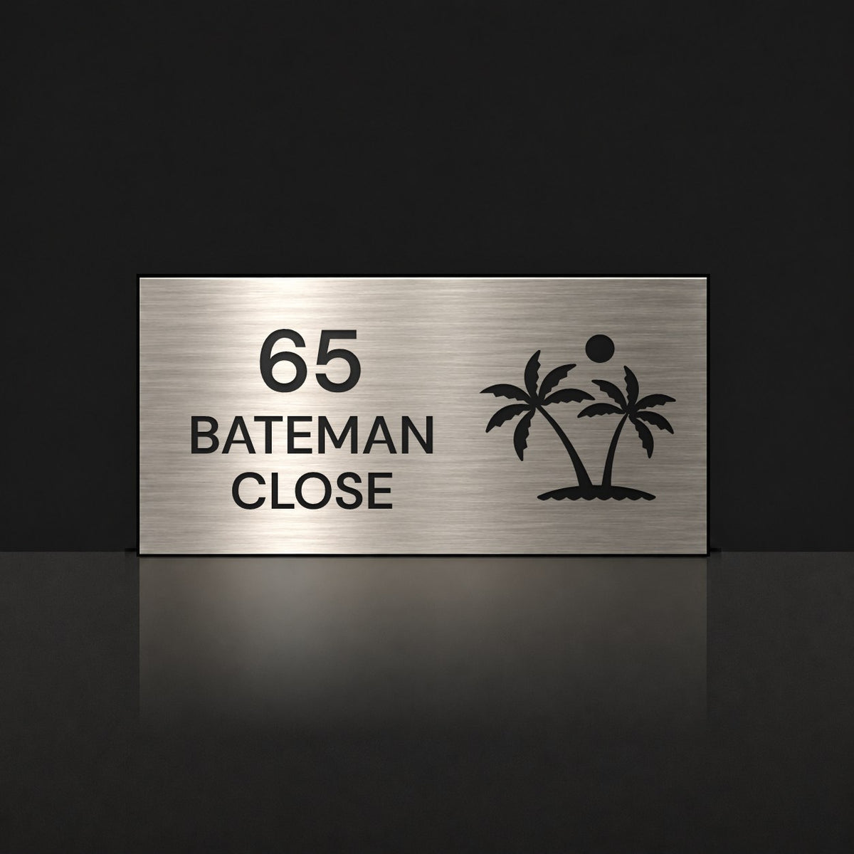 Brushed silver house number and street name sign with a brushed metal look, The Yaroomba, reading 65 Bateman Close in black lettering, with palm trees and a sun.