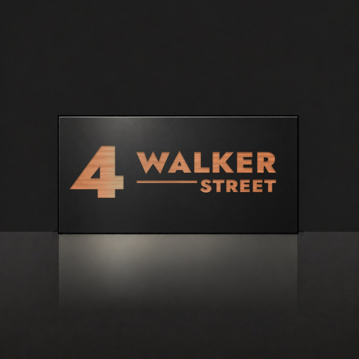Brushed copper house number and street name sign with a brushed metal look, The Alexandra, black face reading 4 Walker Street in copper lettering.