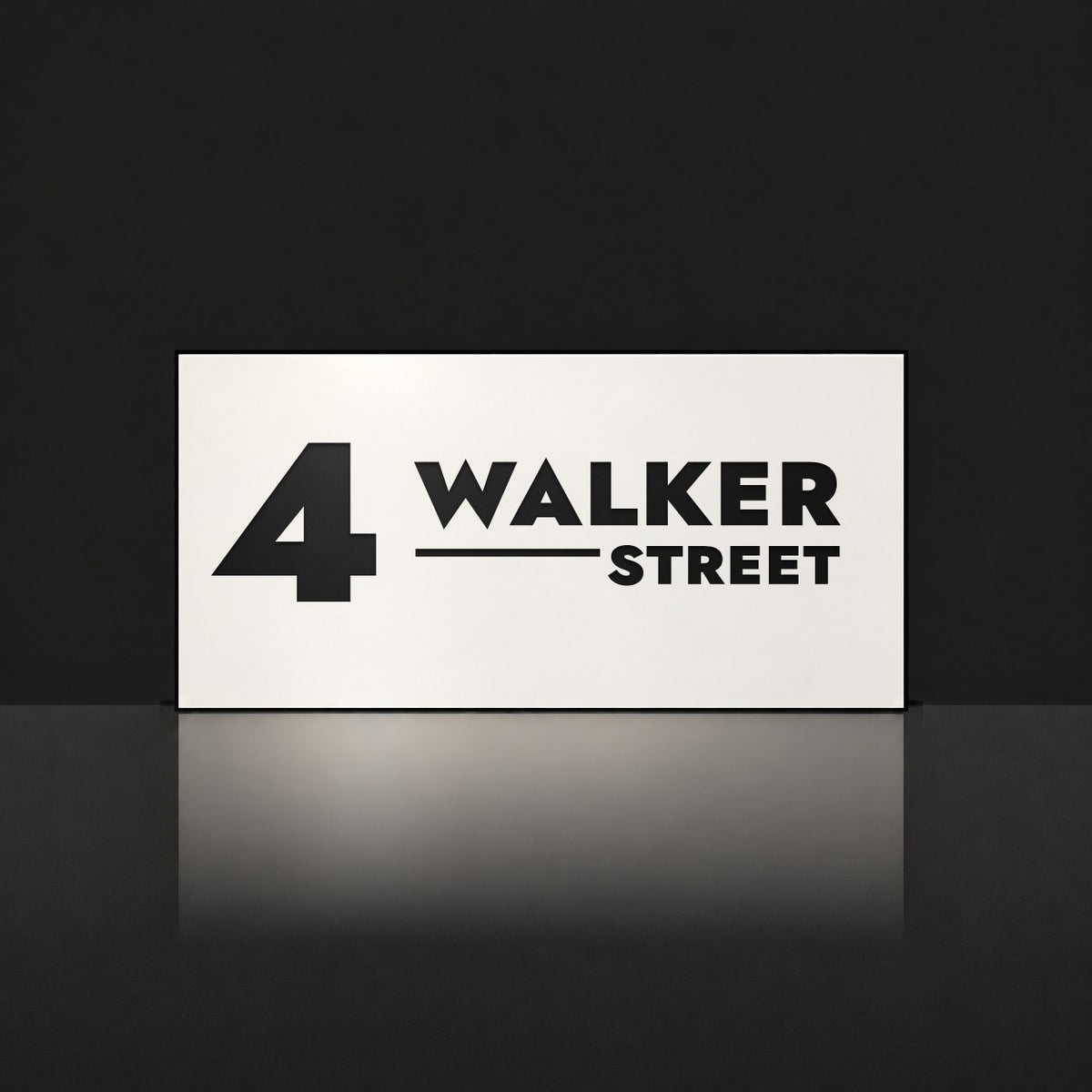 Matte white house number and street name sign, The Alexandra, reading 4 Walker Street in black lettering.