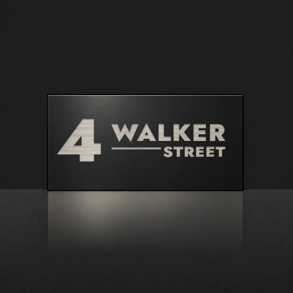 Brushed silver house number and street name sign with a brushed metal look, The Alexandra, black face reading 4 Walker Street in silver lettering.