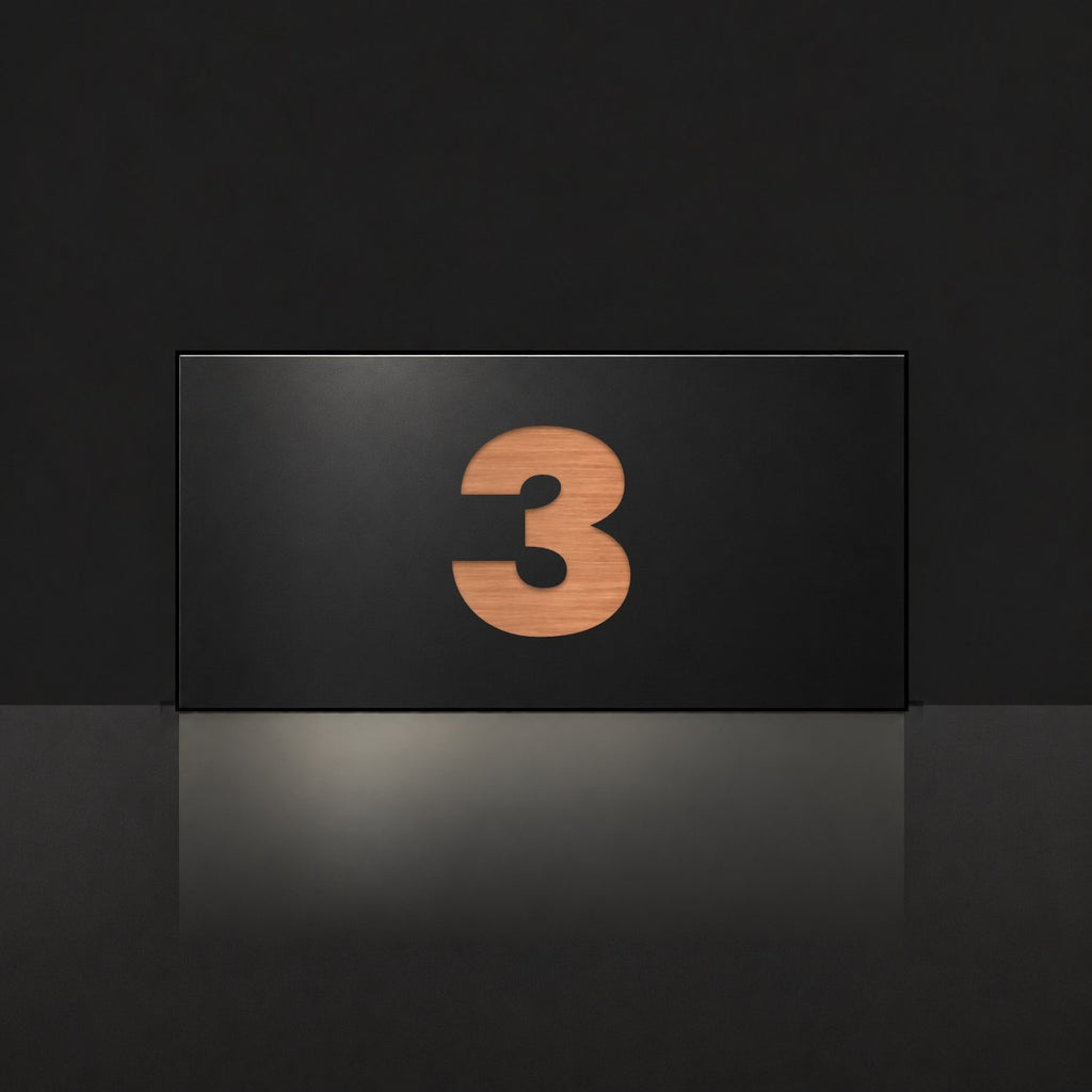 Brushed copper house number sign with a brushed metal look, The Kawana, black face with the number 3 in copper lettering.