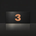 Brushed copper house number sign with a brushed metal look, The Kawana, black face with the number 3 in copper lettering.