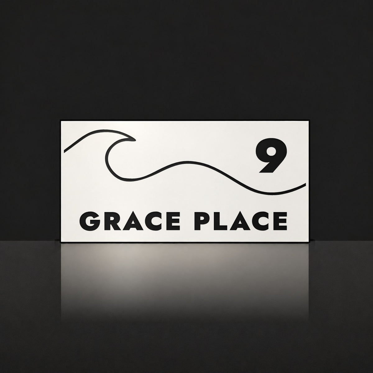 Matte white house number and street name sign, The Moffat, reading 9 Grace Place in black lettering, with a wave.