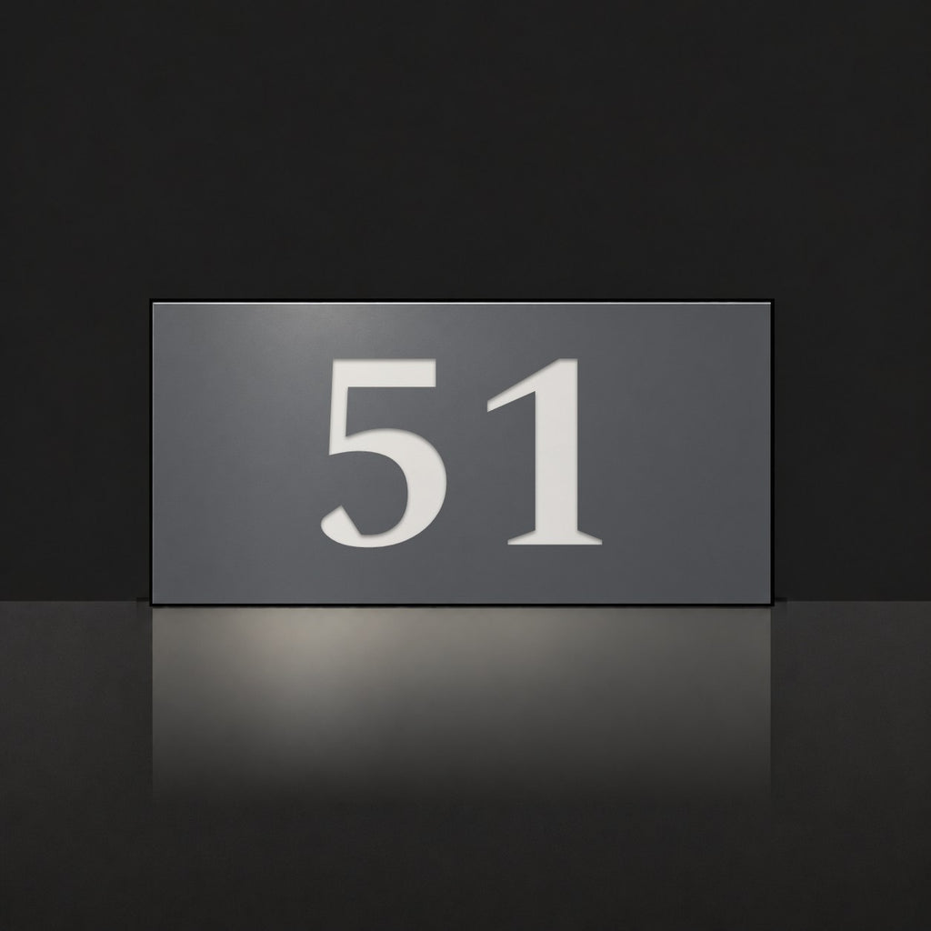 Matte charcoal house number sign, The Kawana, with the number 51 in white lettering.