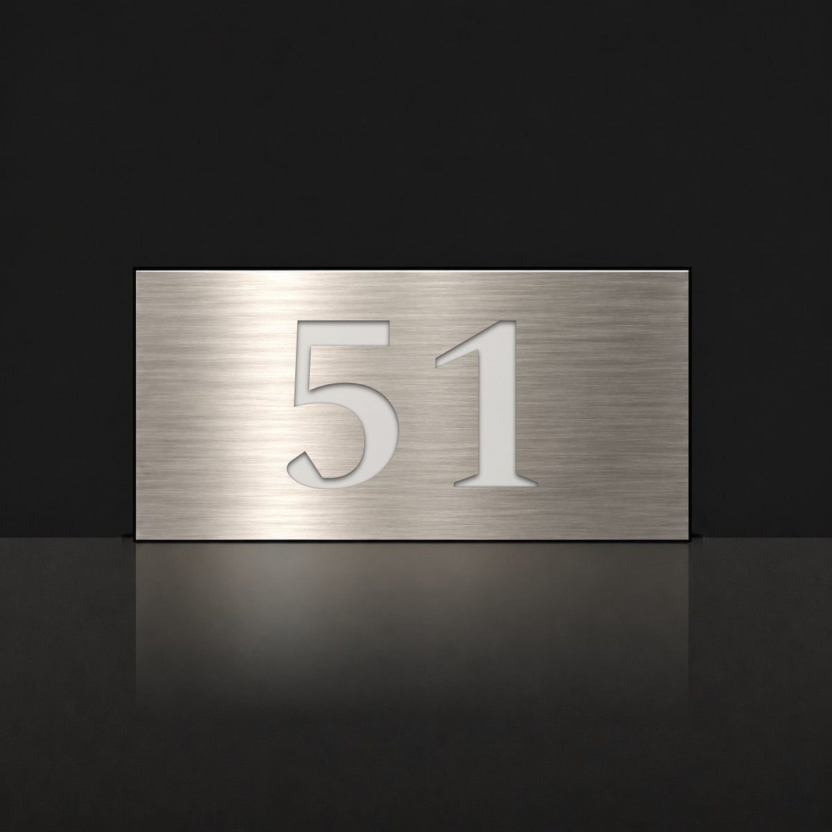 Brushed silver house number sign with a brushed metal look, The Kawana, with the number 51 in white lettering.