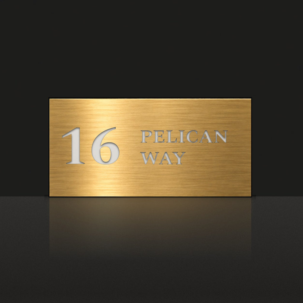 Brushed gold house number and street name sign with a brushed metal look, The Maleny, reading 16 Pelican Way in white lettering.