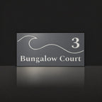 Matte charcoal house number and street name sign, The Moffat, reading 3 Bungalow Court in white lettering, with a wave.