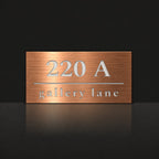Brushed copper house number and street name sign with a brushed metal look, The Noosa, reading 220A Gallery Lane in white lettering.