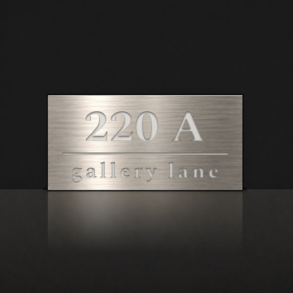 Brushed silver house number and street name sign with a brushed metal look, The Noosa, reading 220A Gallery Lane in white lettering.