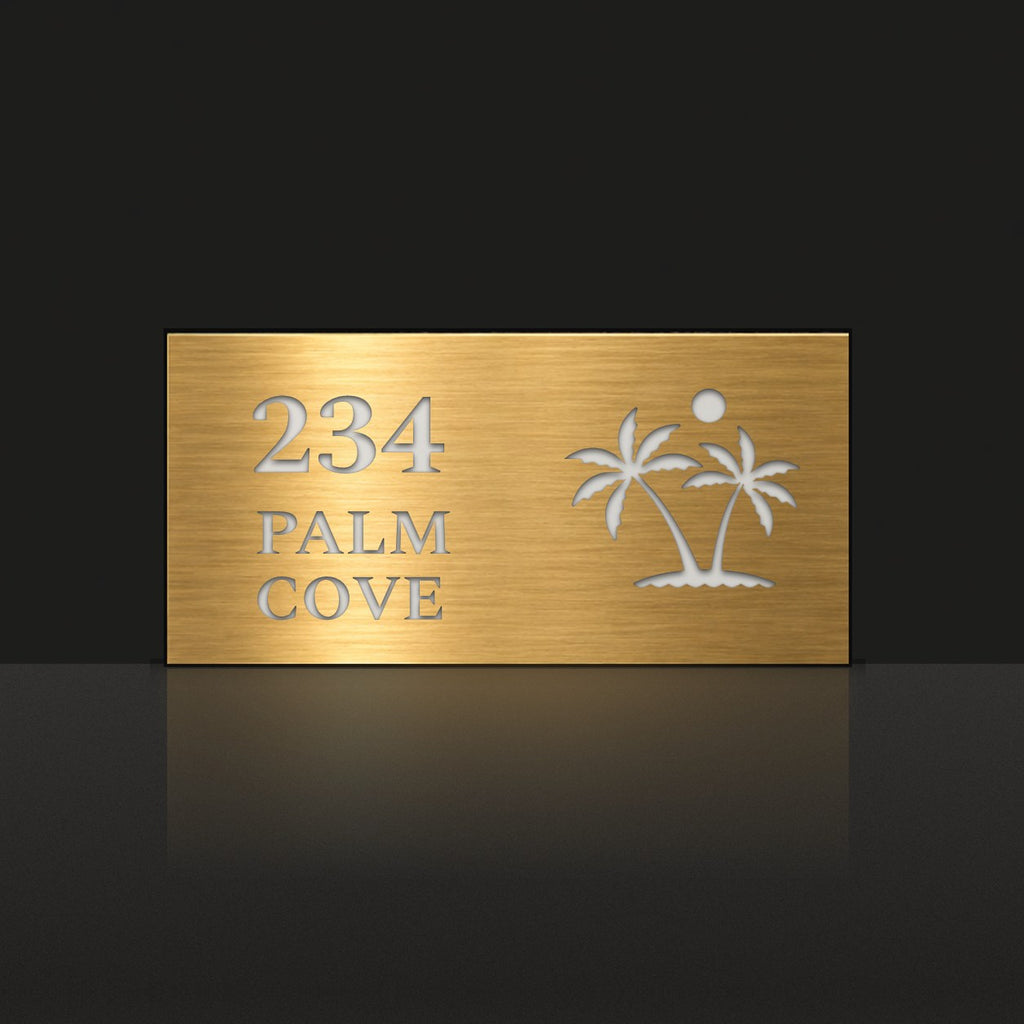 Brushed gold house number and street name sign with a brushed metal look, The Yaroomba, reading 234 Palm Cove in white lettering, with palm trees and a sun.