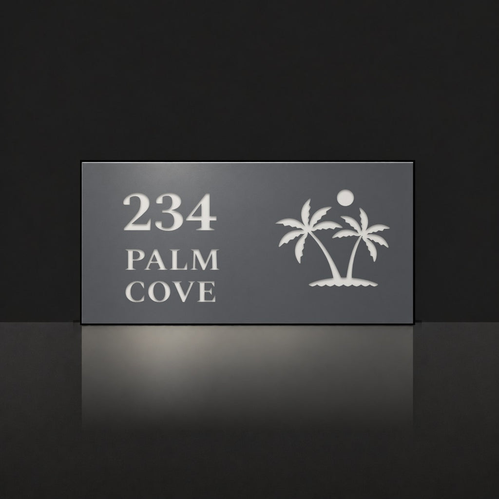 Matte charcoal house number and street name sign, The Yaroomba, reading 234 Palm Cove in white lettering, with palm trees and a sun.
