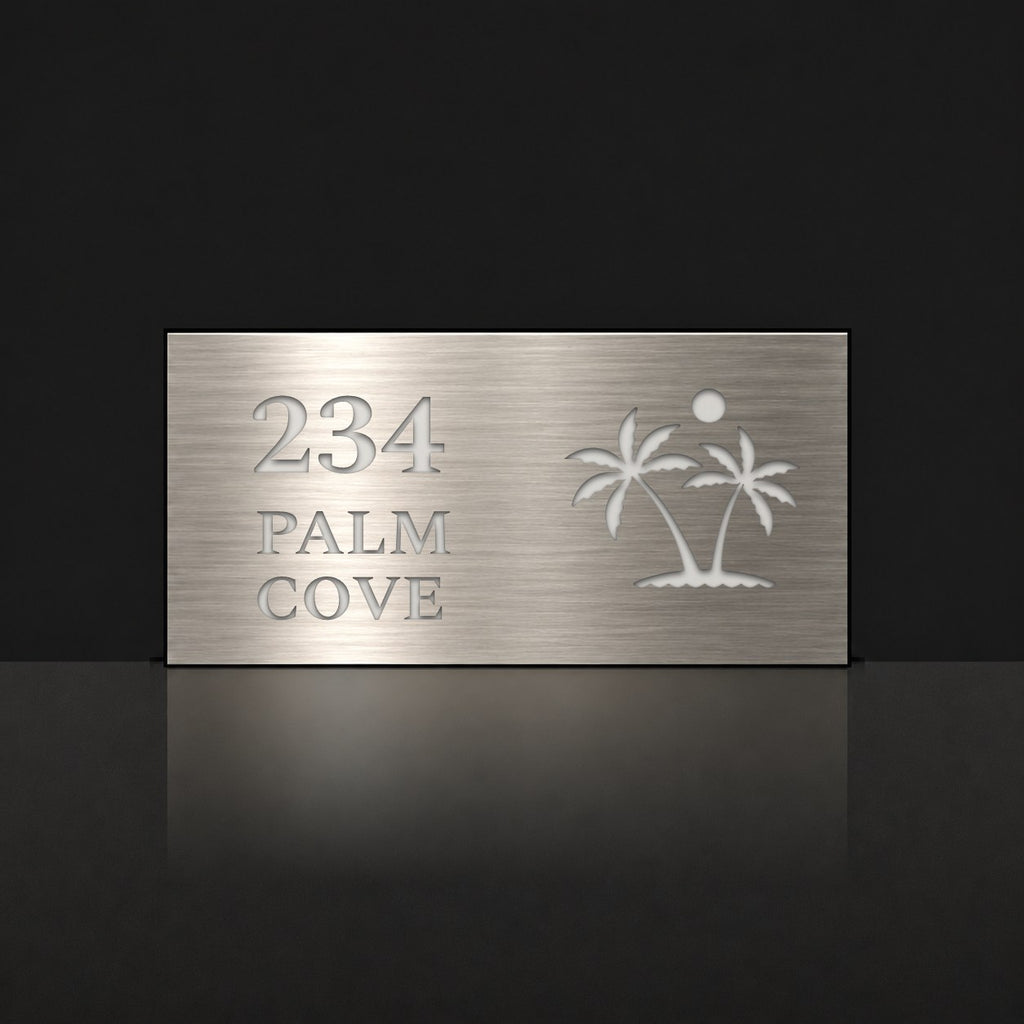 Brushed silver house number and street name sign with a brushed metal look, The Yaroomba, reading 234 Palm Cove in white lettering, with palm trees and a sun.