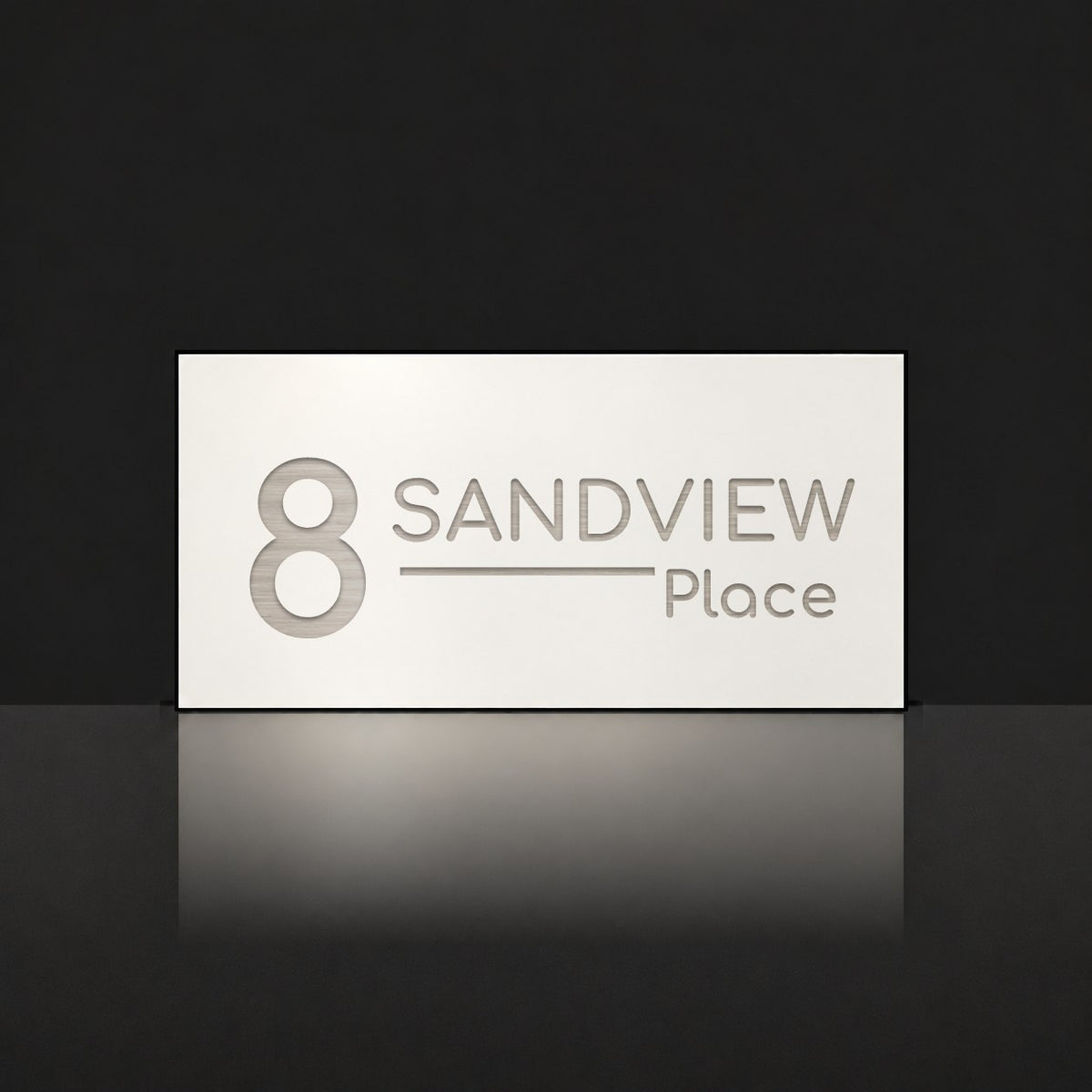 Brushed silver house number and street name sign with a brushed metal look, The Alexandra, white face reading 8 Sandview Place in silver lettering.