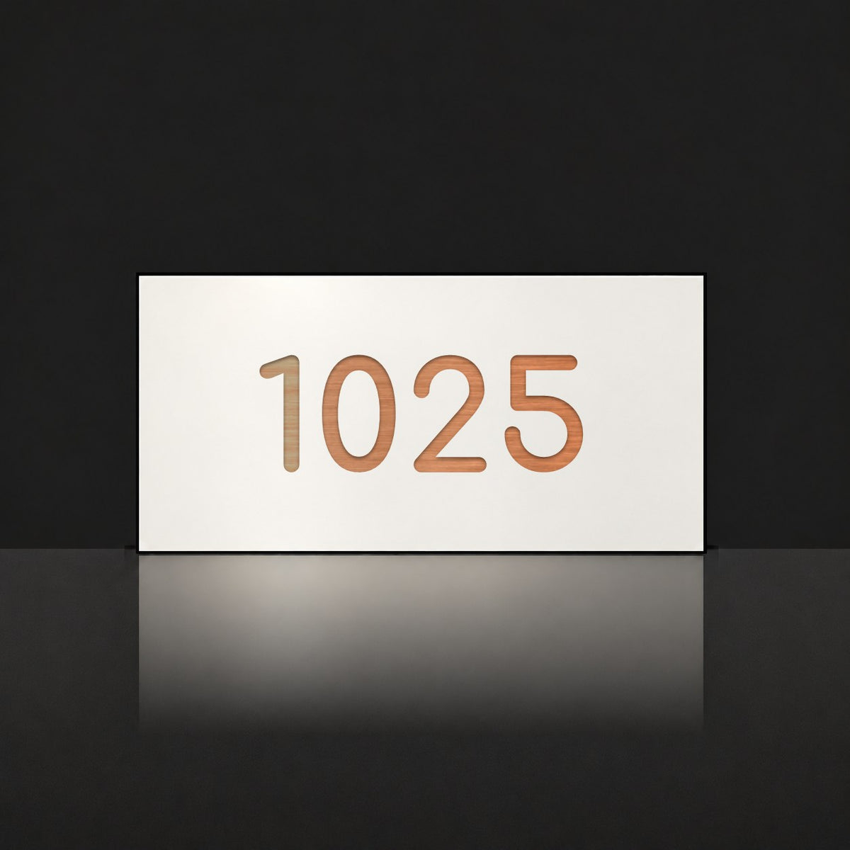 Brushed copper house number sign with a brushed metal look, The Kawana, white face with the number 1025 in copper lettering.