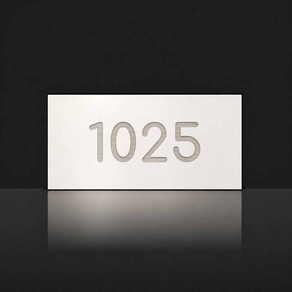 Brushed silver house number sign with a brushed metal look, The Kawana, white face with the number 1025 in silver lettering.