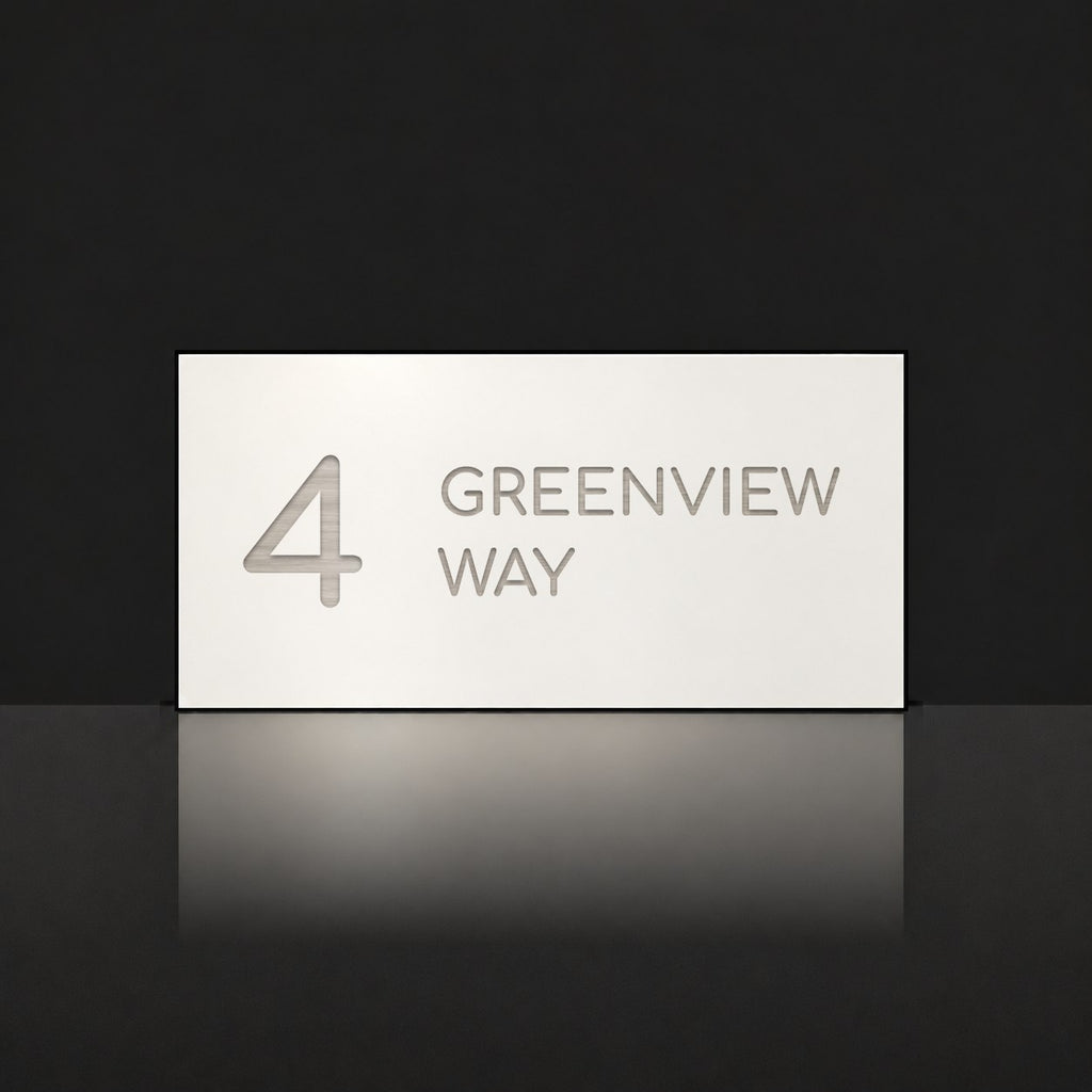 Brushed silver house number and street name sign with a brushed metal look, The Marcoola, white face reading 4 Greenview Way in silver lettering.
