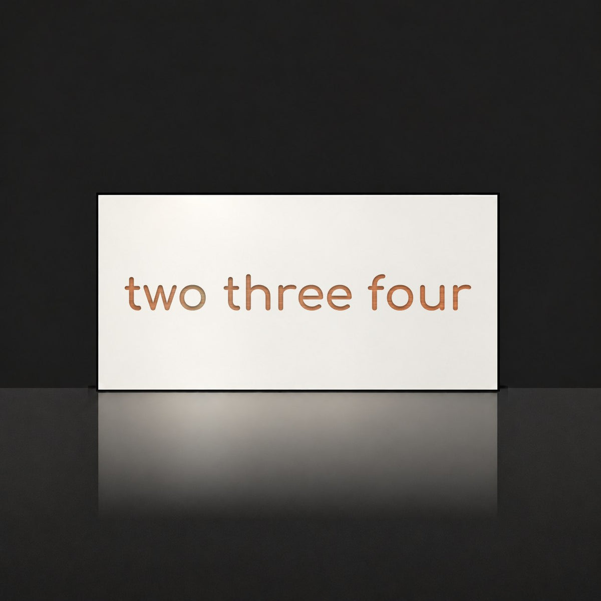 Brushed copper house number sign with a brushed metal look, The Montville, white face with the number spelled out as two three four in copper lettering.