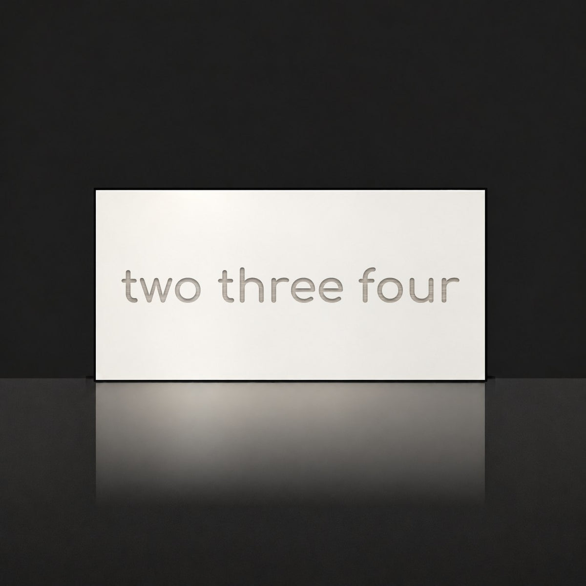 Brushed silver house number sign with a brushed metal look, The Montville, white face with the number spelled out as two three four in silver lettering.