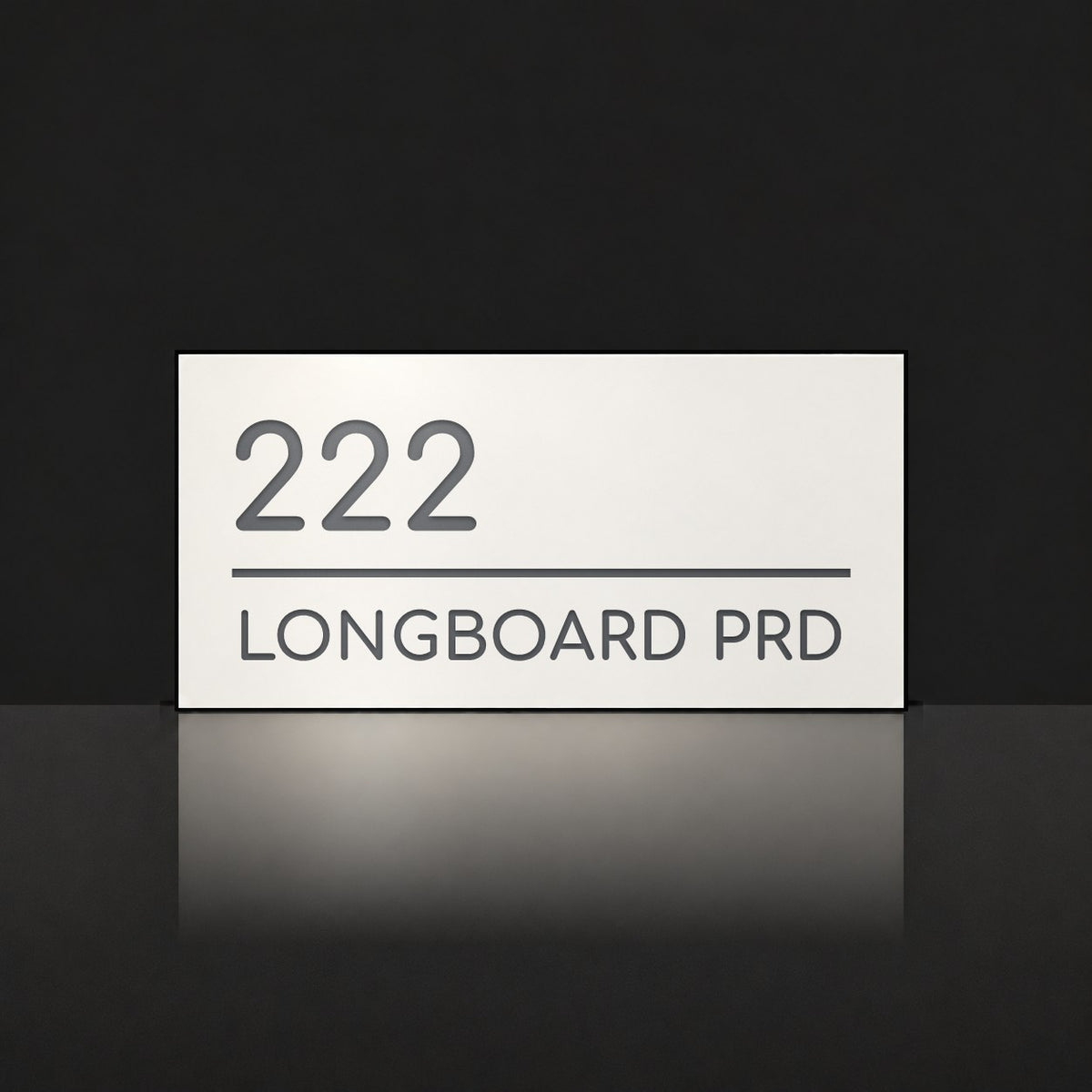 Matte white house number and street name sign, The Noosa, reading 222 Longboard Prd in charcoal lettering.
