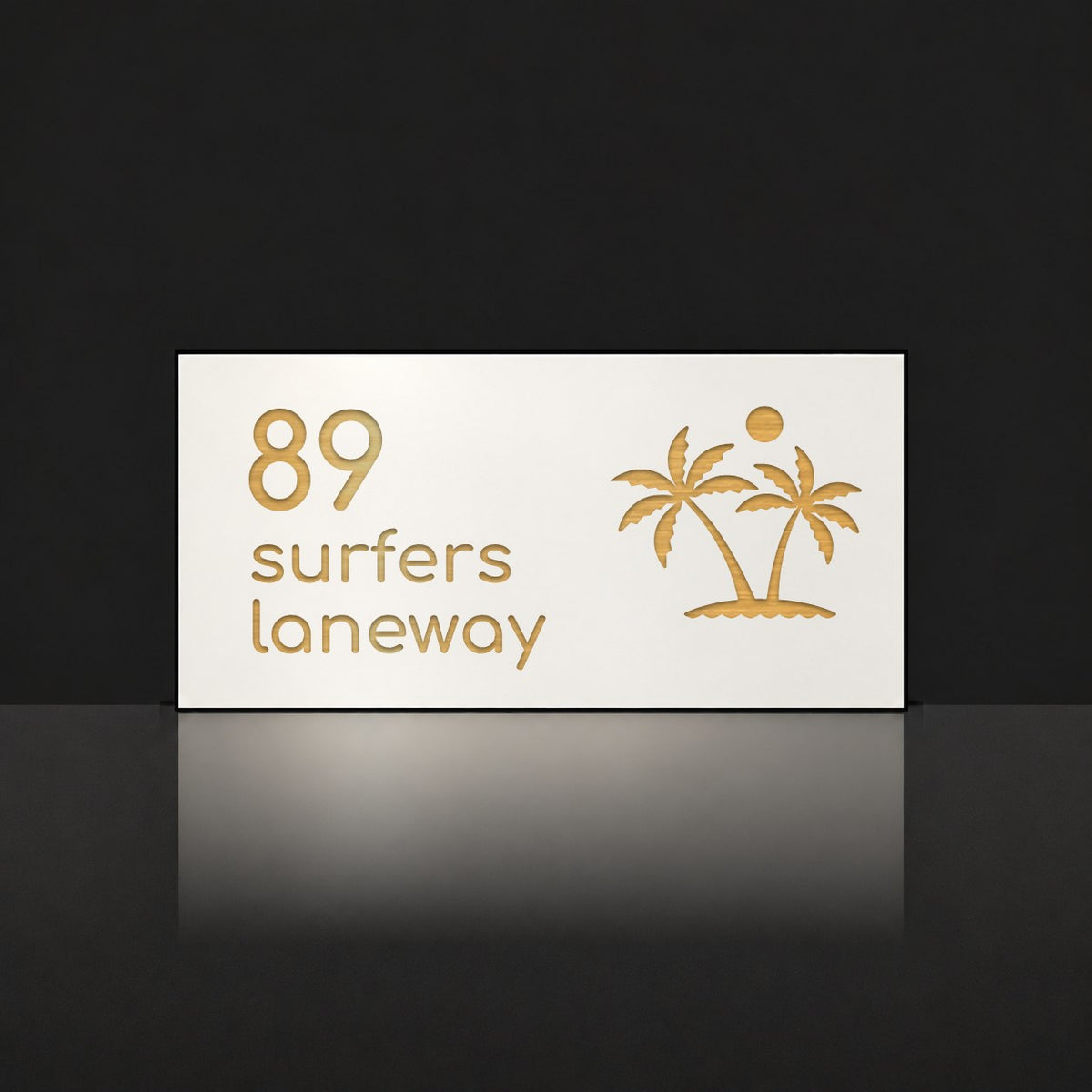 Brushed gold house number and street name sign with a brushed metal look, The Yaroomba, white face reading 89 Surfers Laneway in gold lettering, with palm trees and a sun.