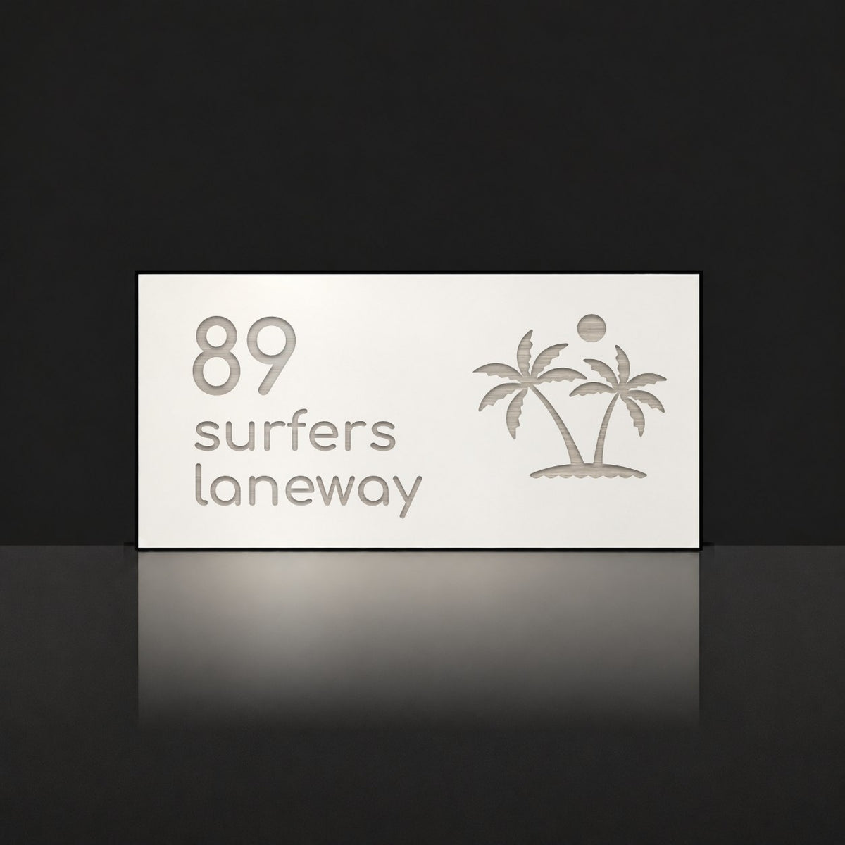 Brushed silver house number and street name sign with a brushed metal look, The Yaroomba, white face reading 89 Surfers Laneway in silver lettering, with palm trees and a sun.