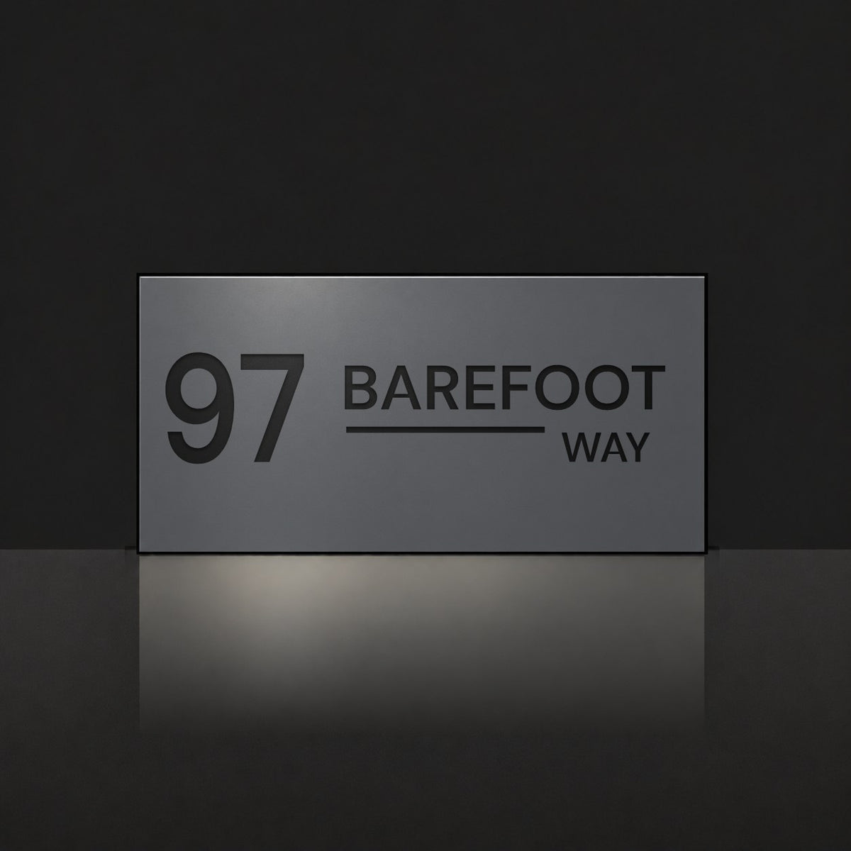 Matte charcoal house number and street name sign, The Alexandra, reading 97 Barefoot Way in black lettering.