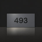 Matte charcoal house number sign, The Kawana, with the number 493 in black lettering.
