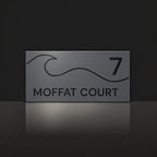 Matte charcoal house number and street name sign, The Moffat, reading 7 Moffat Court in black lettering, with a wave.