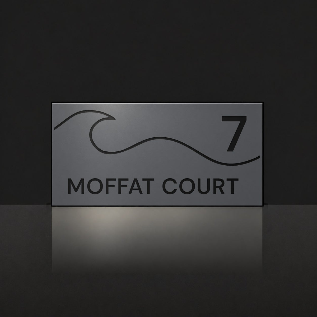 Matte charcoal house number and street name sign, The Moffat, reading 7 Moffat Court in black lettering, with a wave.