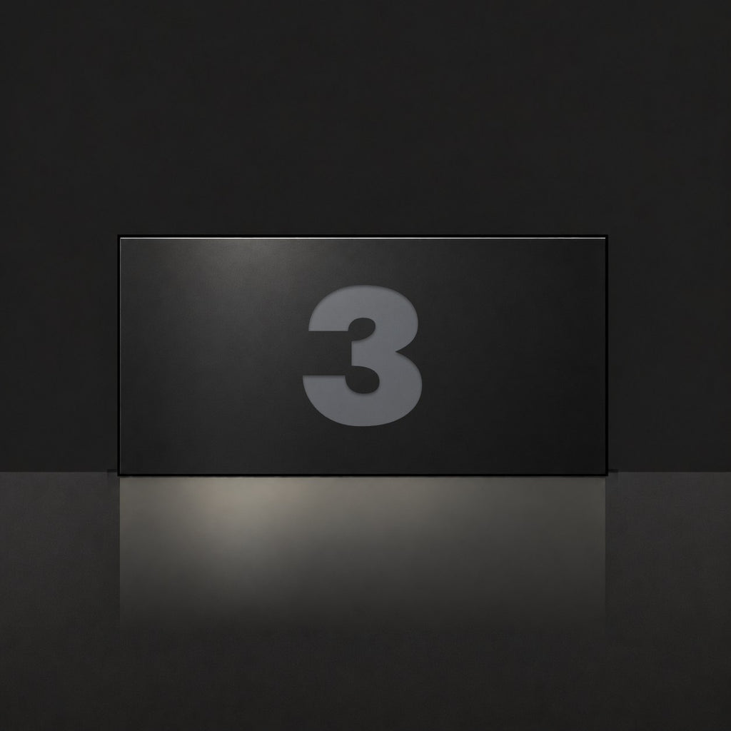 Matte black house number sign, The Kawana, with the number 3 in charcoal lettering.
