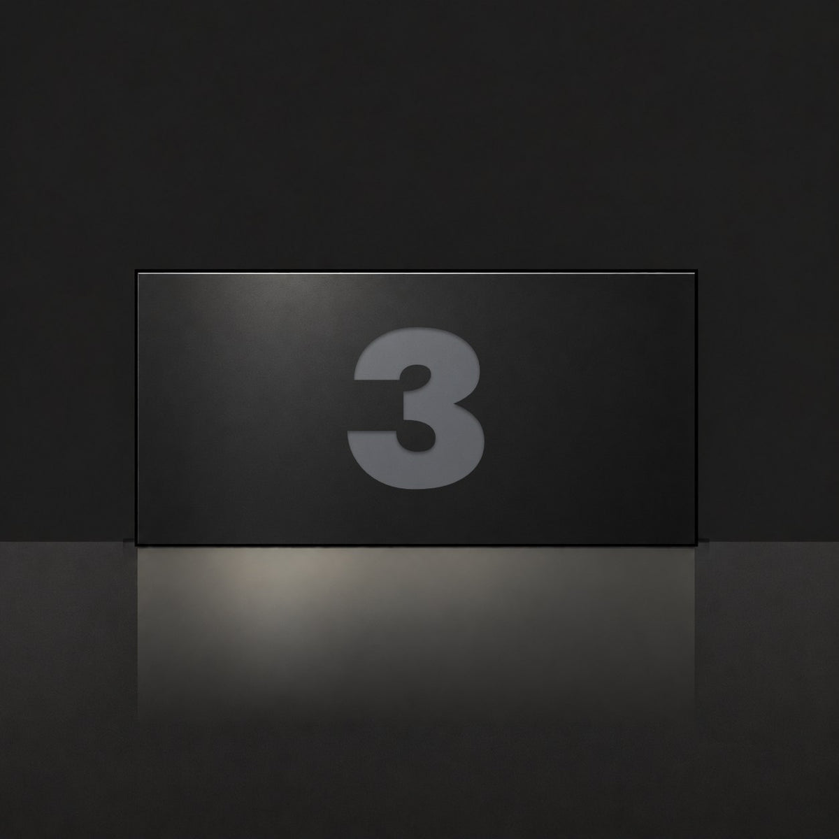 Matte black house number sign, The Kawana, with the number 3 in charcoal lettering.