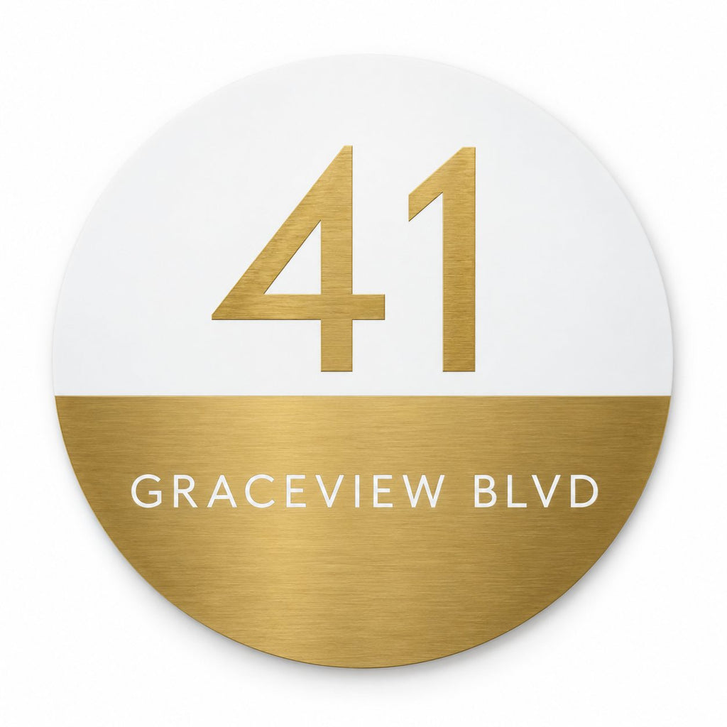 Gold round house number and street name sign reading 41 Graceview Blvd, white top half with a brushed gold number over a brushed gold bottom half with a white street name, The Buddina style.