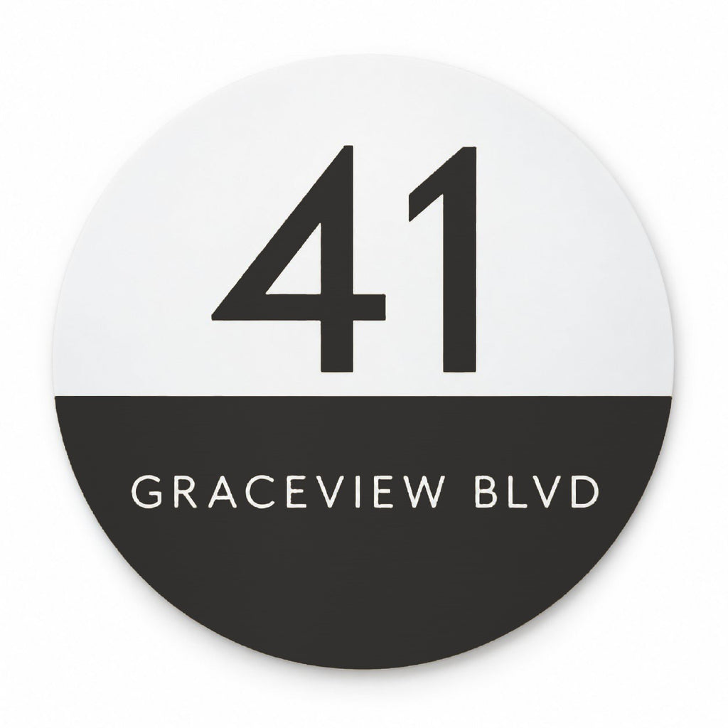 Matte round house number and street name sign reading 41 Graceview Blvd, white top half with a black number over a black bottom half with a white street name, The Buddina style.