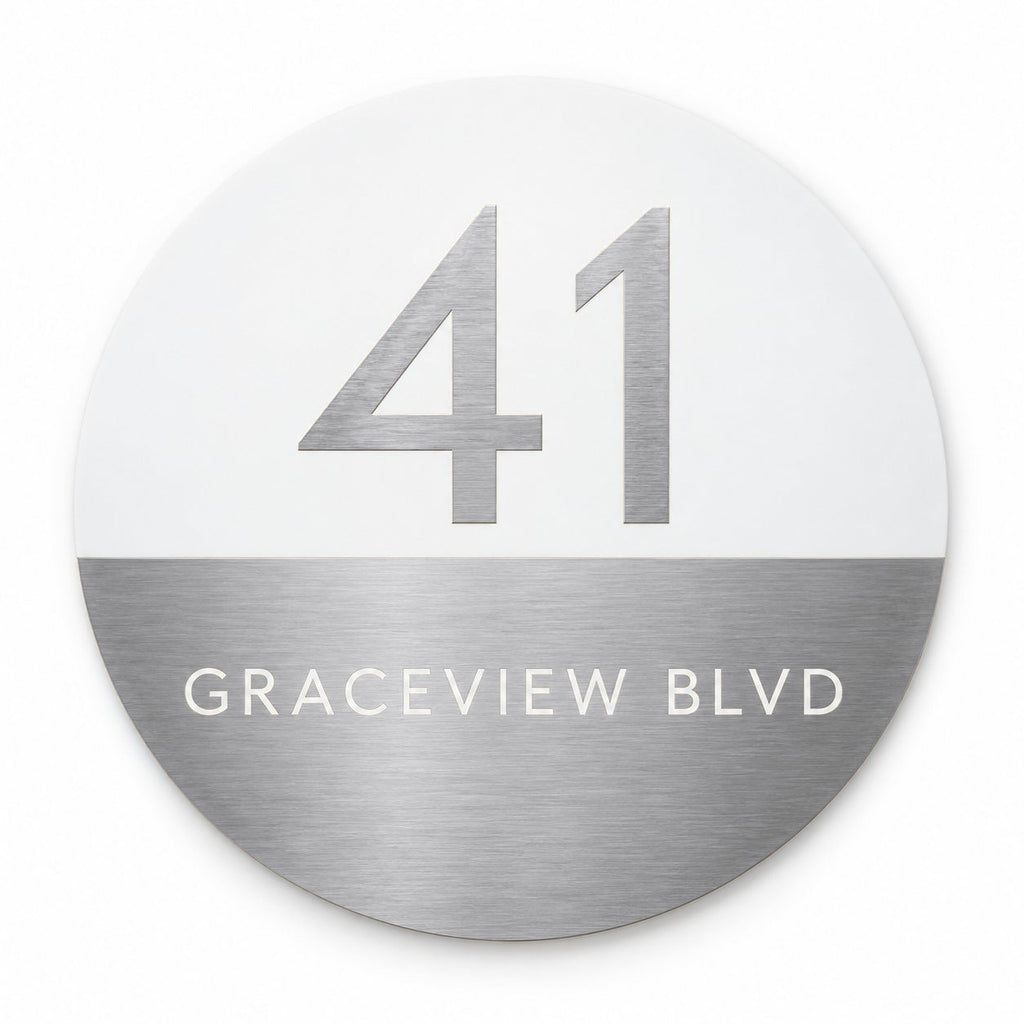 Silver round house number and street name sign reading 41 Graceview Blvd, white top half with a brushed silver number over a brushed silver bottom half with a white street name, The Buddina style.