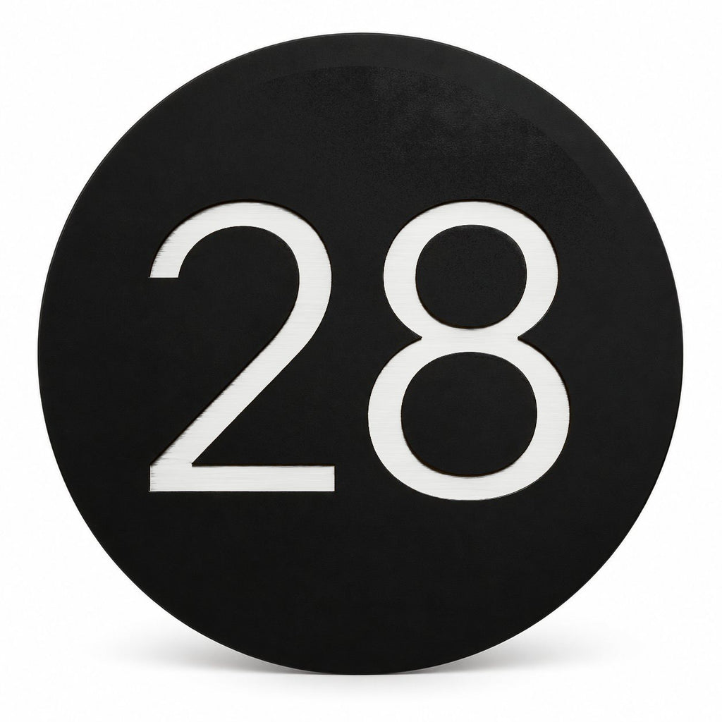 Matte black round house number sign with the number 28 in white, The Caloundra style, on a plain white background.