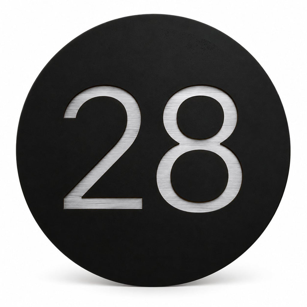 Black round house number sign with the number 28 in brushed silver, The Caloundra style, on a plain white background.