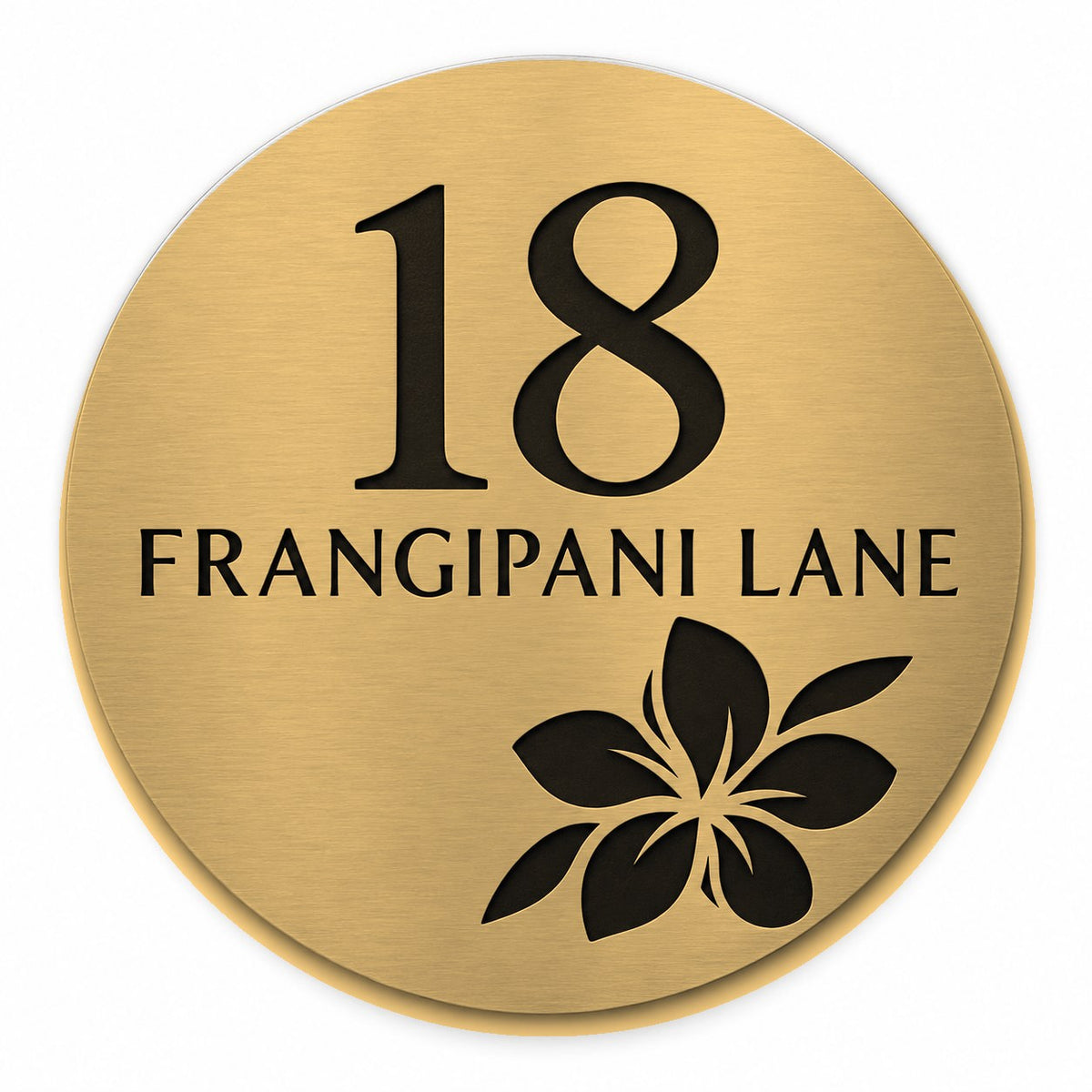 Brushed gold round house number and street name sign reading 18 Frangipani Lane with a frangipani flower cut through to black, The Currimundi style, on a plain white background.